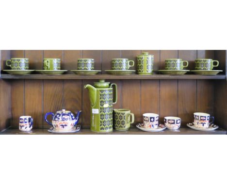 A Hornsea Heirloom coffee service, in green with six coffee cups and saucers, and a Wadeheath Tete a Tete tea service in Imar