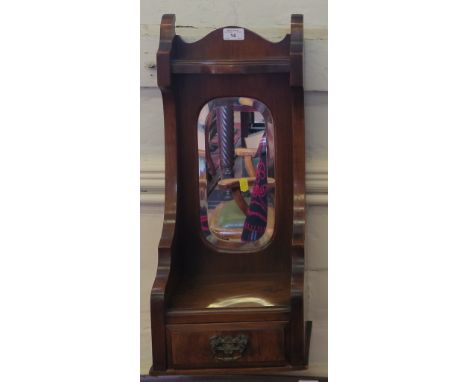 A stained glass octagonal wall mirror with bevelled plate and ribbon design, 48cm square and another mirror with trinket draw