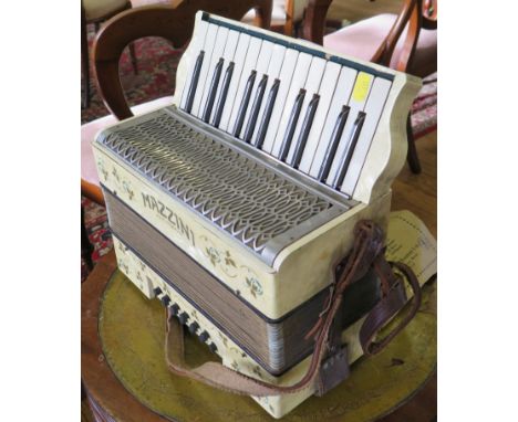 A Mazzini accordion, with two octave keyboard and twelve buttons, 32cm
