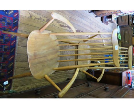 A pair of Ercol beech and elm Windsor armchairs stamped with BS 1960 kite mark C.F. 2056 (2)