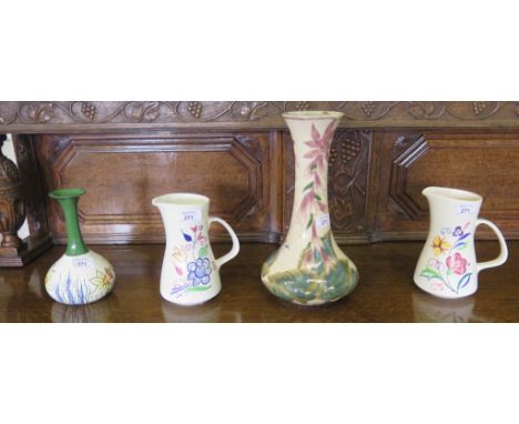 A Corbridge Stoneware vase with long neck and purple floral decoration, 33cm high, a limited edition Lorna Bailey vase, 179/2