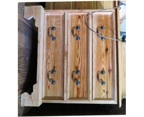 A pine chest of drawers, with three long drawers on bracket feet, 71cm wide