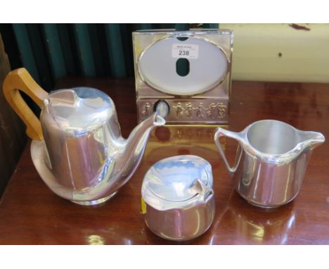 A Picquot ware three piece tea service, of organic form and a Wedgwood photo frame with jasper ware pendant 