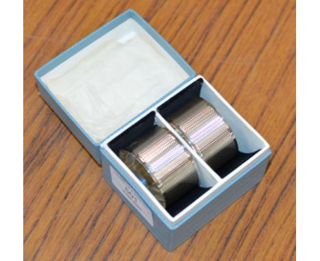 BOXED PAIR OF BIRMINGHAM SILVER ENGINE TOOLED NAPKIN RINGS     