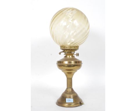 A Victorian / Edwardian brass oil lamp with vintage shade being converted to electric