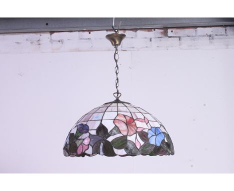 A large  glass panel Tiffany style glass lamp shade with floral design. 50 degrees. 
