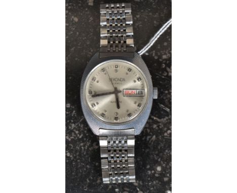 A vintage 1970's Gentlemans Sekonda USSR 25 jewel wristwatch having day/date aperture, silvered dials and unusual seconds bat