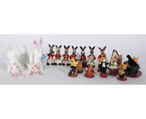 A collection of comical novelty ceramic and cast animal musicians to include animal band by Enesco etc please see images