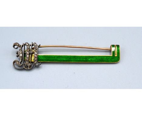 A Yellow and White Metal Green Enamel Set Bar Brooch with diamond encrusted initials 7.7 gms 6.5ms long 