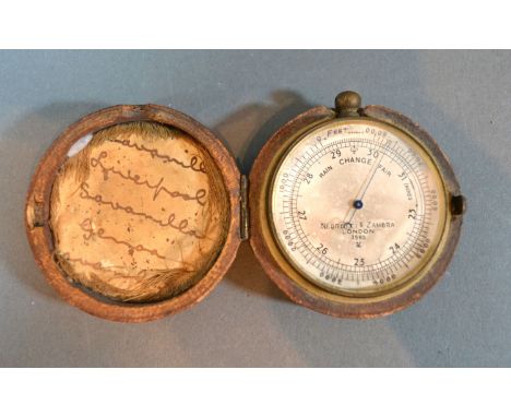 A Small Brass Barometer Negretti &amp; Zambra, London, numbered 3562 within fitted case, 4.5 cms diameter 