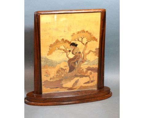 An Art Deco Rosewood Table Screen with marquetry inlaid panel depicting a lady with sheep within a landscape, 29 cms x 28 cms