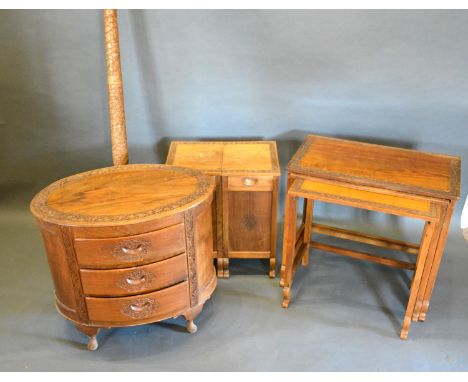 A Continental Carved Hardwood Oval Chest of Three Drawers together with a similar nest of tables, a side cabinet and a lamp s
