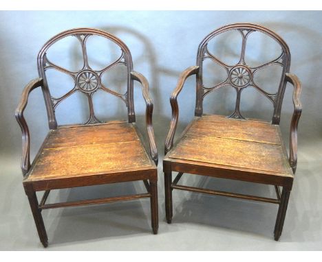 A Pair of Early 19th Century Chippendale Style Armchairs each with a pierced carved back above a panel seat raised upon turne