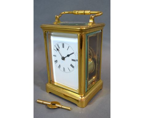 A French Brass Cased Carriage Clock, the enamel dial with Roman numerals and with lever escapement, 13.5 cms tall 