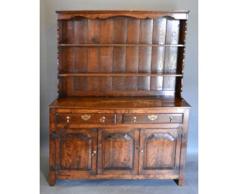 A George III Style Oak Dresser, the boarded shelf back above two drawers and two cupboard doors with central panel flanked by