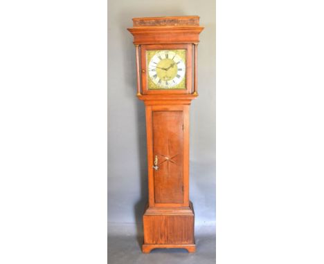 A George III Long Case Clock, the square hood with turned pilasters above a star inlaid door raised upon bracket feet, the si