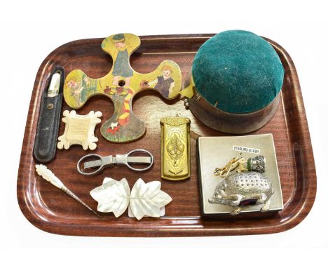 A Small Group of Collectables to Include, a brass vesta, Mother of Pearl Buckle, a white metal hedgehog form pin cushion, a s