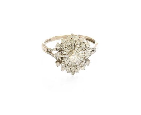 A 9 Carat Gold Diamond Cluster Ring, the stylised floral cluster set throughout with round brilliant cut, eight-cut and bague