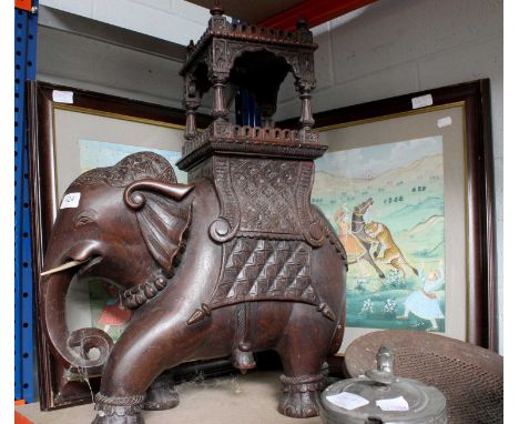 An Indian Carved Hardwood Model of an Elephant and Howdah, 61cm high, together with a pair of Indian watercolours of hunting 