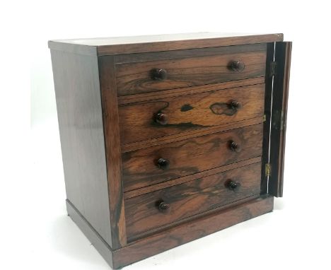 Antique rosewood 4 drawer collectors cabinet with lockable front panel (missing key). 35cm high x  35cm wide x 23cm deep. Has