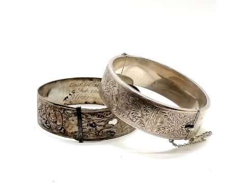 2 x silver bangles - 68g total weight (the half engraved bangle with slight dents is wax filled - the adjustable bangle has i