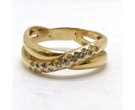 18ct (touch tests as &amp; has foreign mark) diamond set crossover ring - size Q½ &amp; 5.1g total weight &amp; has been resi