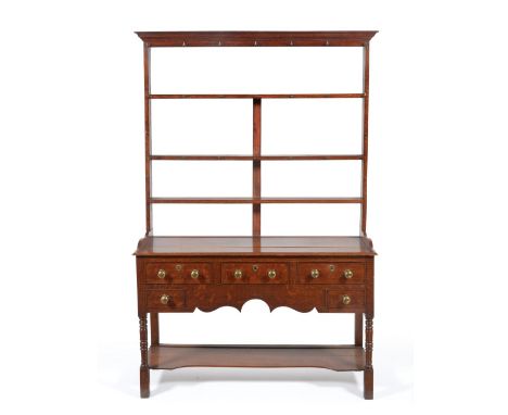 A 19th Century Oak and Pine Dresser, the rack with a moulded cornice over three shelves, the base having a moulded top over t