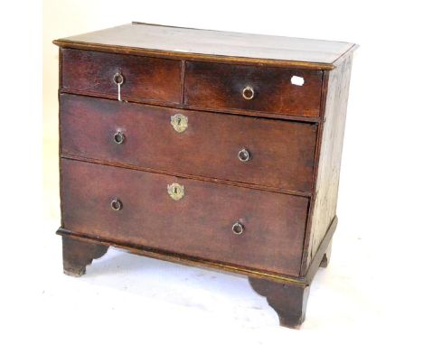 A Small Early 18th Century Oak and Pine Chest of Drawers, with a crossbanded top over two short and two long drawers, on brac