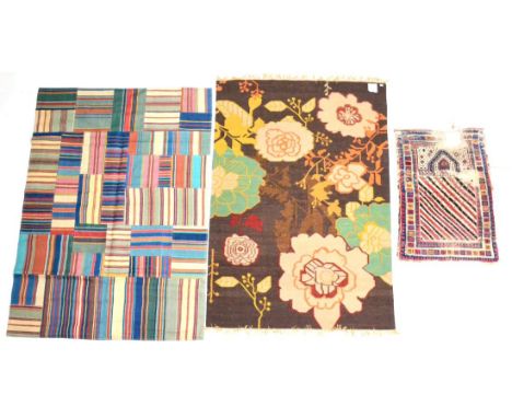 European Flatweave ''Patch'' Rug The compartmentalised field of narrow and broad polychrome bands, 240cm by 172cm; An Indian 