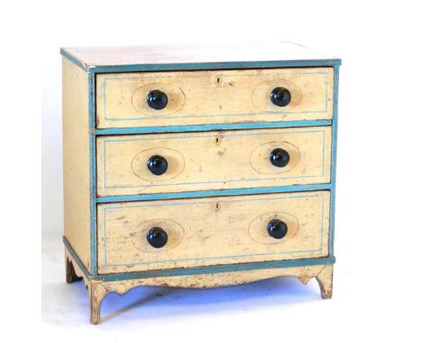 An Early 19th Century Cream Painted Pine Straight Front Chest of Drawers, the three graduated drawers with ebonised knob hand