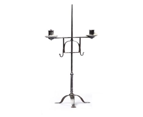 A Steel Two-Light Candelabrum, 17th/18th century, with adjustable scroll branches on a knopped stem and tripod base, 54cm hig
