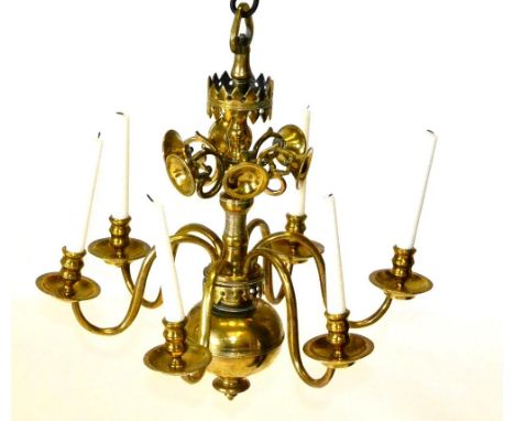 A Brass Six-Light Chandelier, in 17th century style, the baluster stem applied with scrolls and dished plaques above scroll b