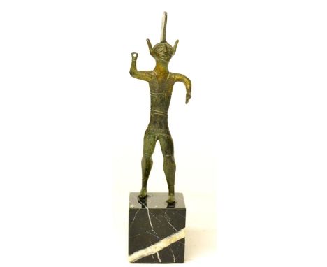 An Etruscan Style Bronze Figure of a Warrior, 11cm high, on a black marble base 