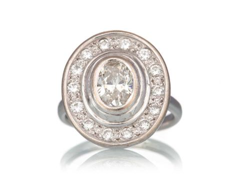 DIAMOND DRESS RING, GIA CERTIFICATED set with an oval diamond of approximately 0.91 carats, within a diamond halo totalling a