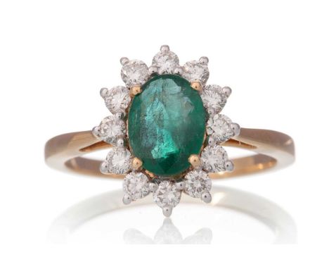 EMERALD AND DIAMOND CLUSTER RING, set with an emerald of approximately 1.30 carats, within a halo of diamonds totalling appro