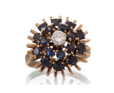 SAPPHIRE AND DIAMOND DRESS RING, set with a central diamond within a double sapphire halo, marked 14K, size OQty: 5.2g
