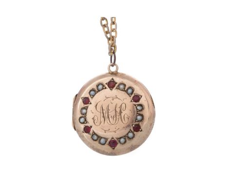 VICTORIAN GEM SET LOCKET, with engraved monogram within a ruby and seed pearl border, in yellow metal, on a similar chain