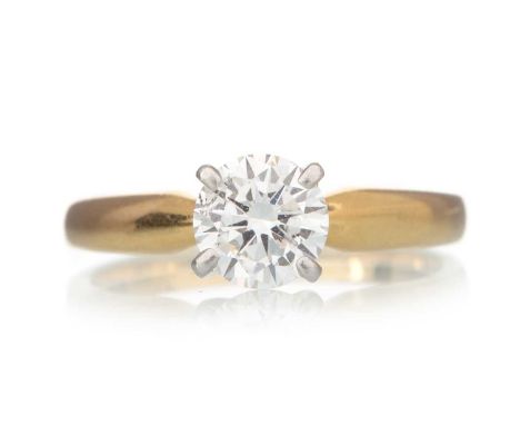 DIAMOND SOLITAIRE RING, set with a round brilliant cut diamond of approximately 0.70 carats, in eighteen carat yellow gold, s