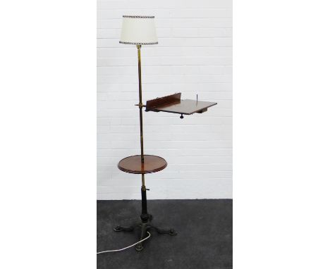 An adjustable standard lamp with sloped reading shelf and cast metal base, 166 cm high From the residual contents of a West C