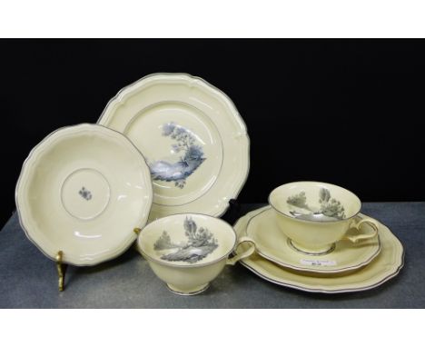 Two Rosenthal porcelain 'Chippendale' patterned cup and saucer trios, comprising two cups, two saucers and two side plates 