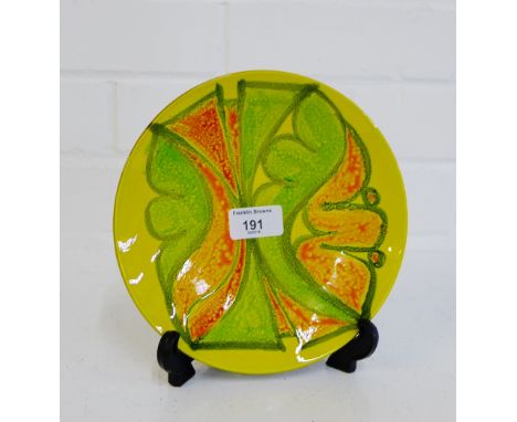 A Poole Delphis yellow glazed plate, 20cm diameter
