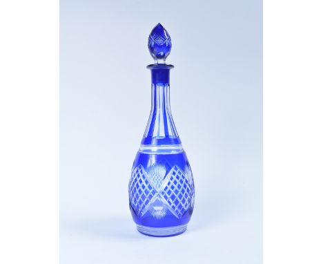 Bohemian blue overlaid decanter circa 1920 of cut form, 37cm