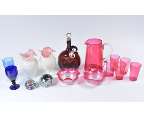 Coloured glass including a brandy decanter, cranberry, two paperweights and others