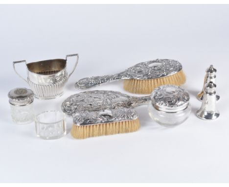 A small quantity of various silver wares including a sugar basin with half fluted body 107 grams, two silver topped jars, two
