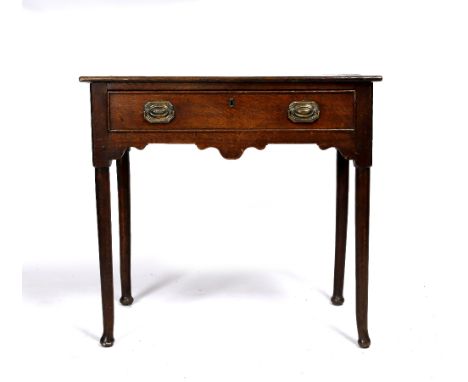A 19th Century oak side table the rectangular top over single drawer on turned supports and bun feet, 74cm high, 78cm wide