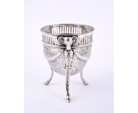 A silver sugar basin of circular form with pierced geometric decoration, swept supports and ram's head masks, Sheffield 1776,