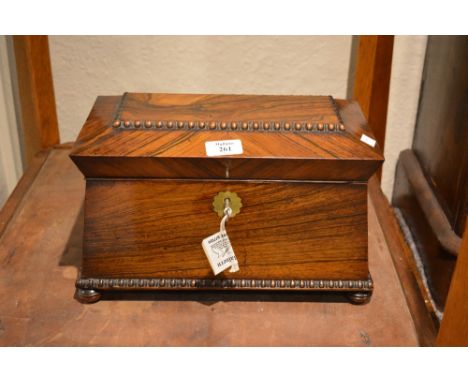A Victorian rosewood tea caddy of domed form, fitted interior, 33cm