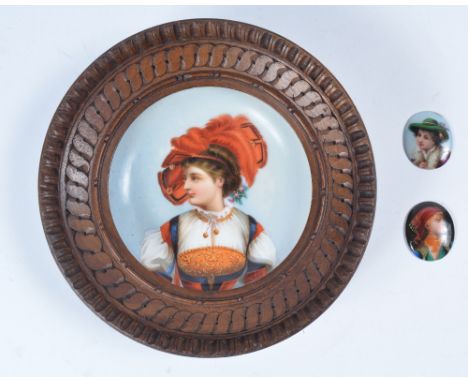 A continental porcelain plaque 19th Century painted with girl with feather hat, framed, 10cm and two small continental porcel