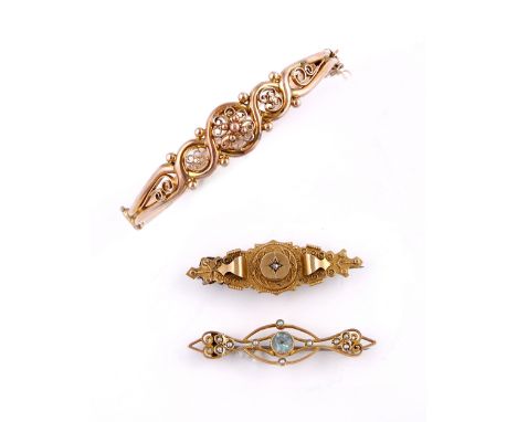 A Victorian bangle  with stylised setting, together with an Edwardian bar brooch with aquamarine and pearl setting and a Vict
