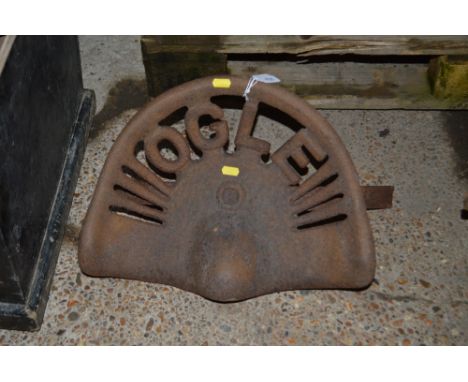 An Ogle cast iron vintage tractor seat